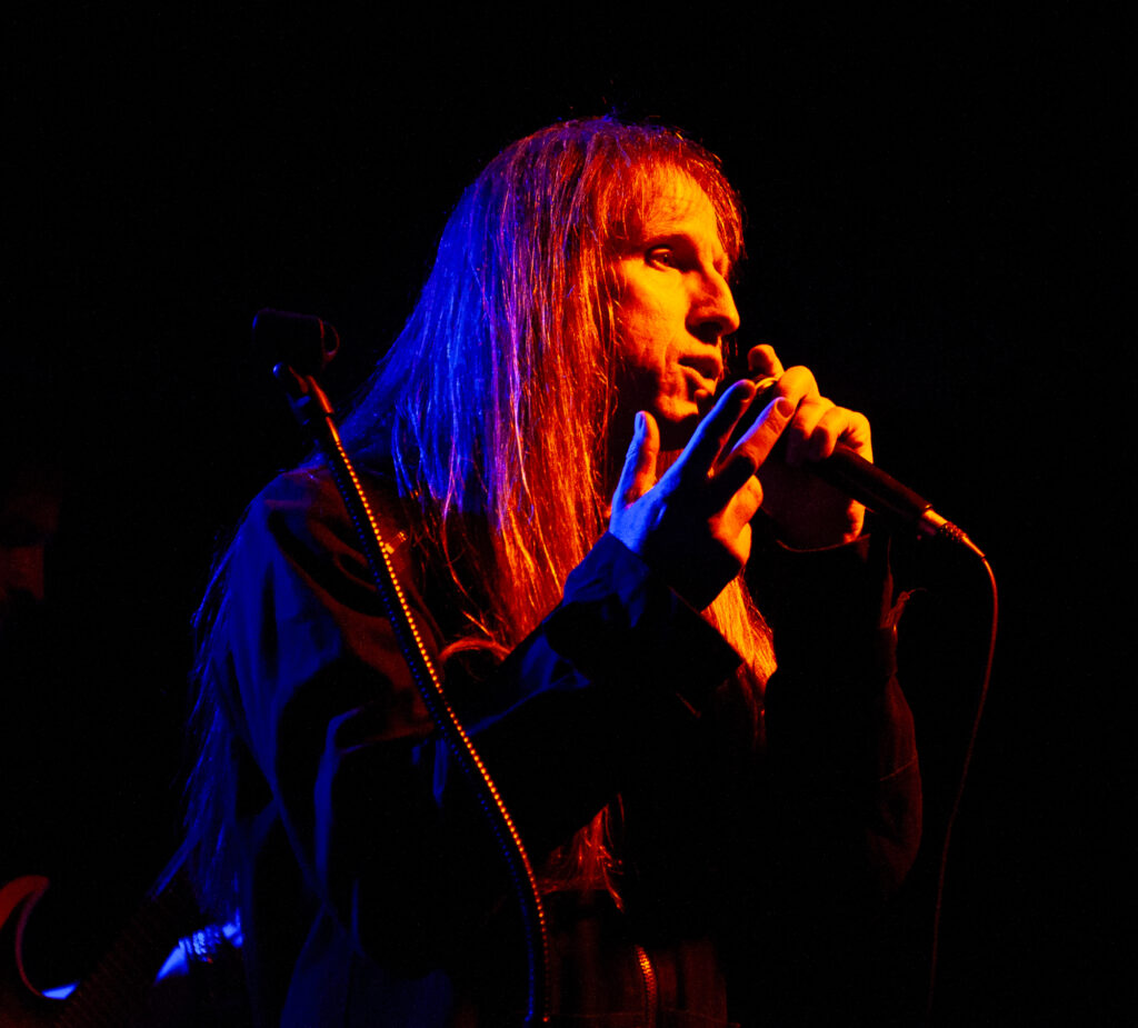 concert photography of metal band Nightmare Empire singer mood shot at The Vortex in Arkon