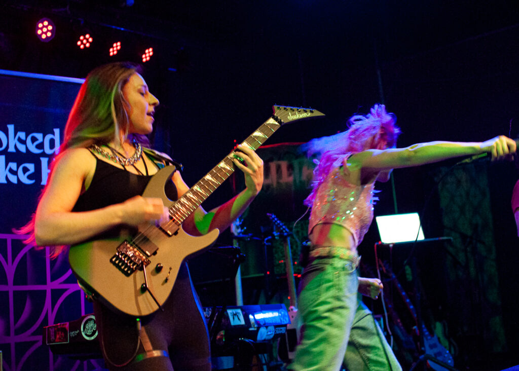 concert photography of rock band Hooked Like Helen singer and guitarist at Winchester in Lakewood