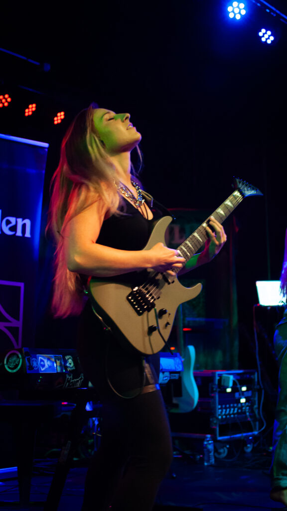concert photography of rock band Hooked Like Helen guitarist at Winchester in Lakewood