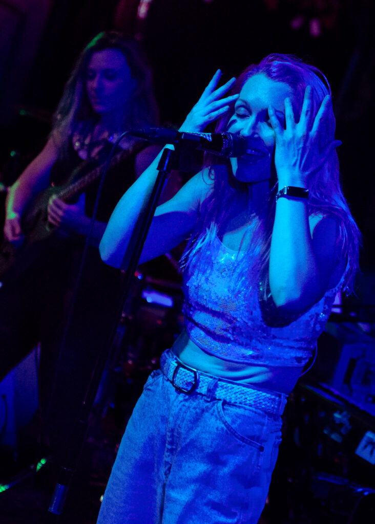 concert photography of rock band Hooked Like Helen singer at Winchester in Lakewood