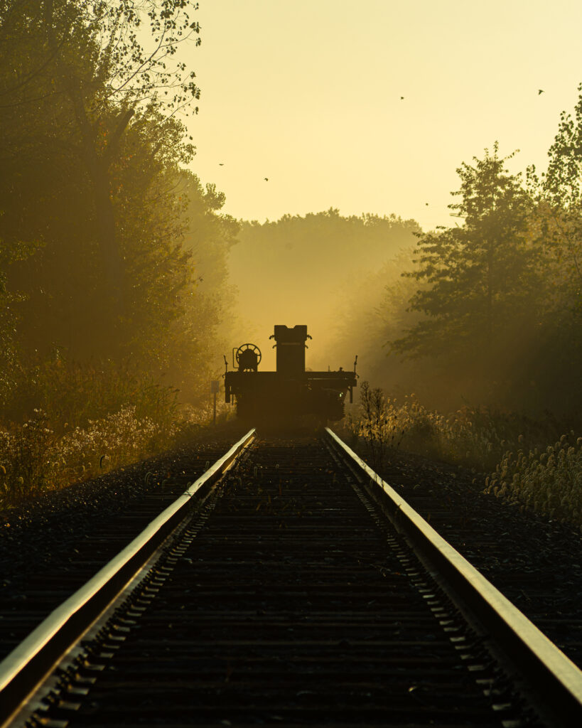 nature photography of train tracks in foggy morning forest in sheffield lake