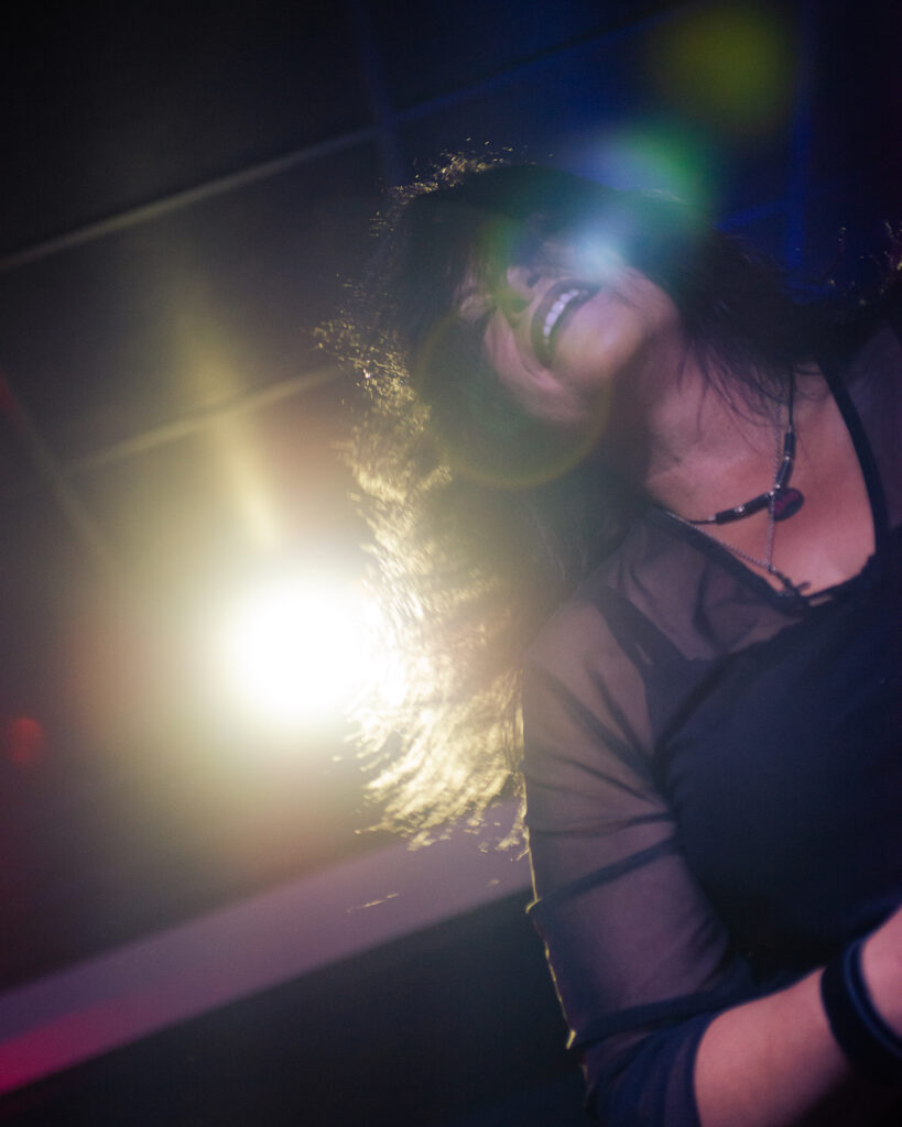 concert photography of Olathia singer at Beachland Tavern with glowing background spotlight